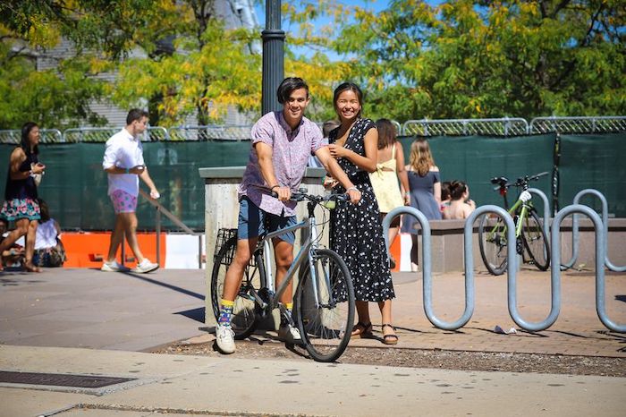 Bicyclist with smiling woman