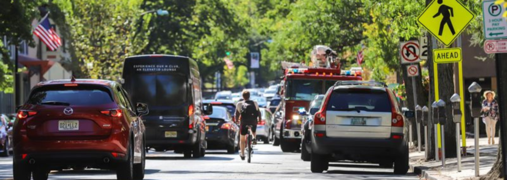 street with cars and bicyclist